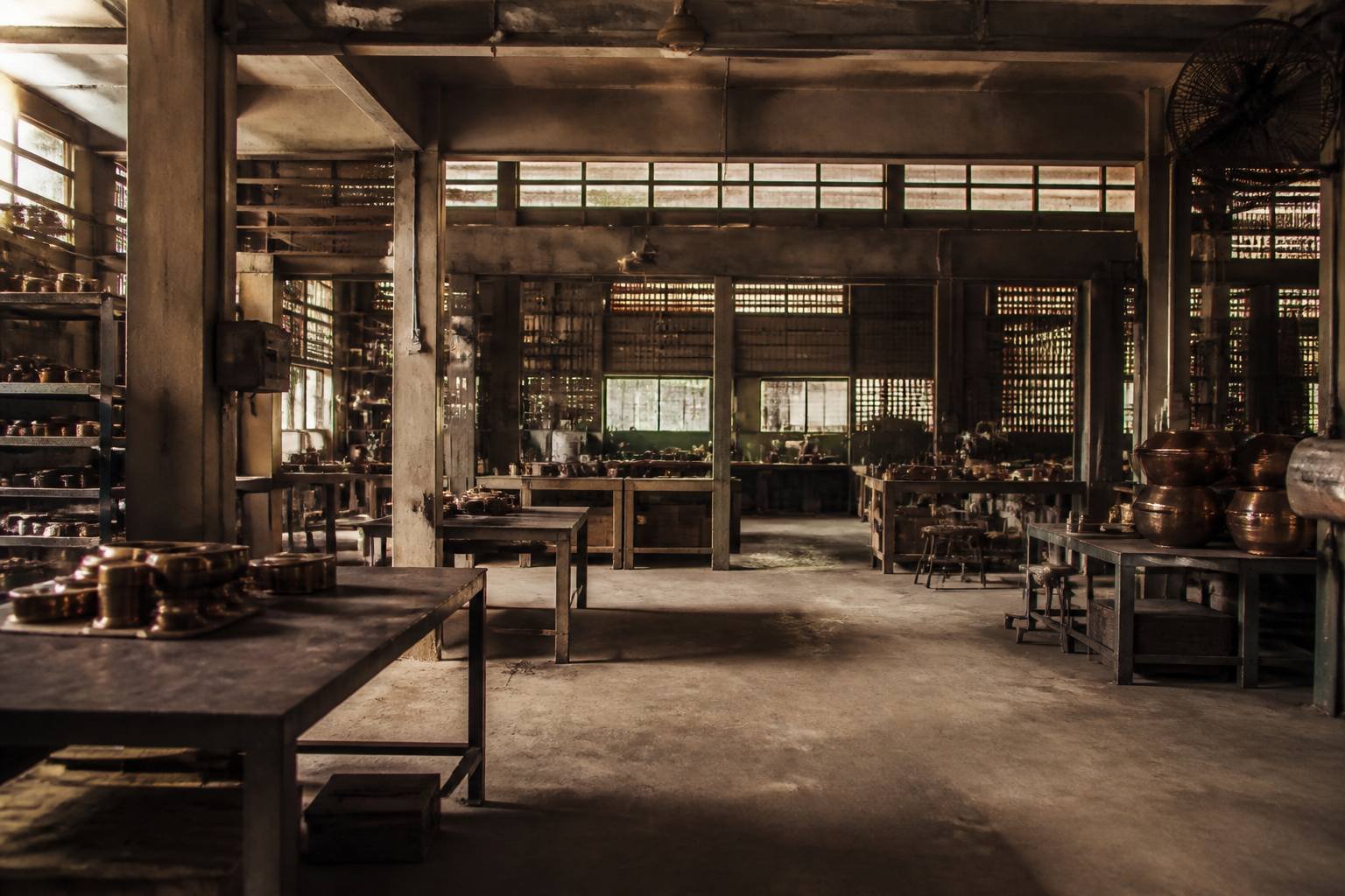 Atmospheric study of a quiet metal workshop interior.